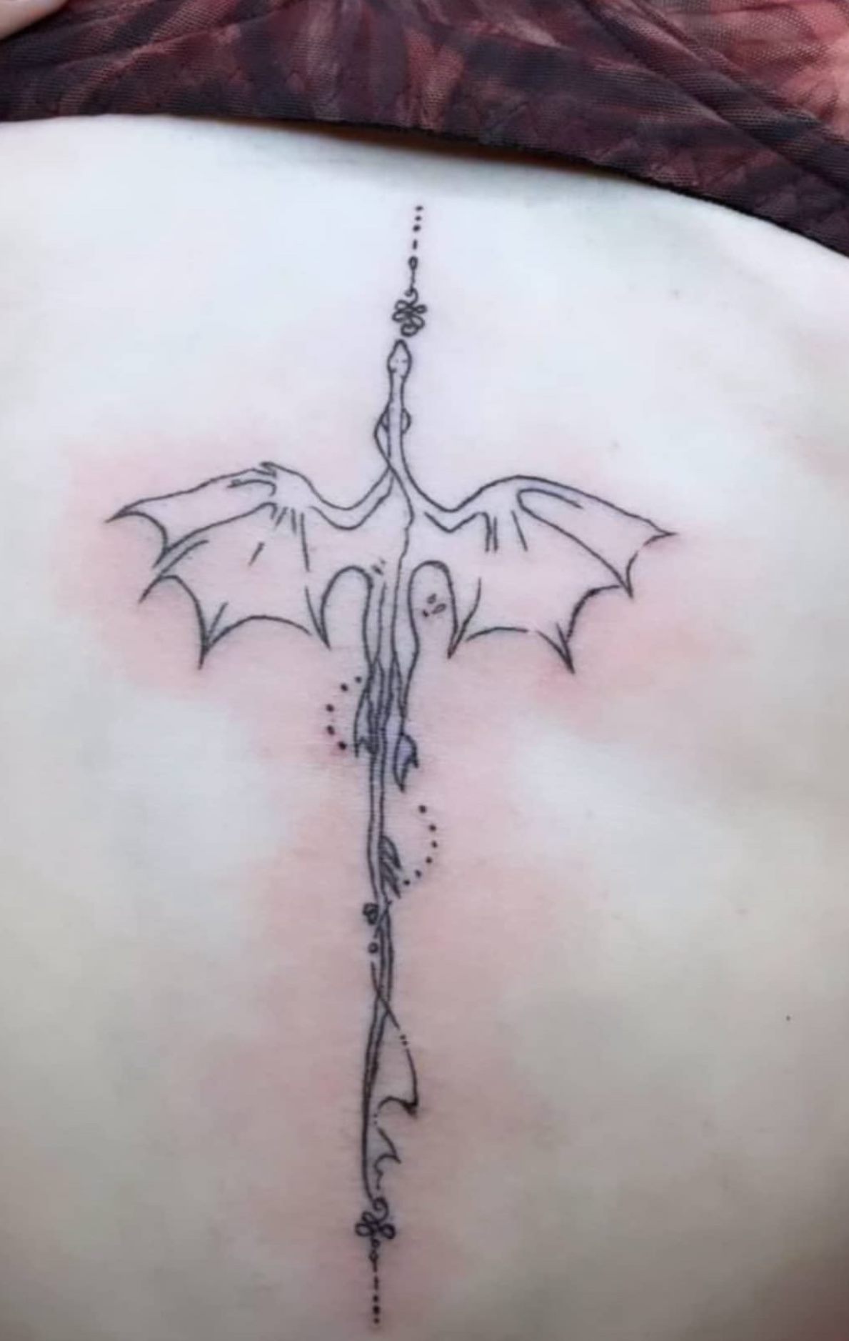 Before — fine line spine tattoo